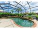 Enclosed pool and spa with brick coping at 4713 Mainsail Dr, Bradenton, FL 34208