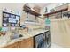 Laundry room with granite countertops and built-in shelving at 4713 Mainsail Dr, Bradenton, FL 34208