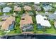 An aerial shot of a canal-front home featuring a pool and a tranquil outdoor space at 4713 Mainsail Dr, Bradenton, FL 34208