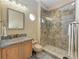 Updated bathroom with a walk-in shower and tile flooring at 4713 Mainsail Dr, Bradenton, FL 34208