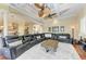 Open living room with sectional sofa and view into kitchen at 4713 Mainsail Dr, Bradenton, FL 34208