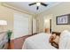 Well-lit bedroom with a queen bed and en-suite bathroom at 4713 Mainsail Dr, Bradenton, FL 34208