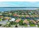 Aerial view of a waterfront community with upscale homes and lush landscaping at 4713 Mainsail Dr, Bradenton, FL 34208