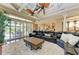 Gathering room with sectional sofa, large screen TV and access to kitchen at 4713 Mainsail Dr, Bradenton, FL 34208