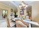 Bright dining room with a large mirror and view into another room at 4713 Mainsail Dr, Bradenton, FL 34208