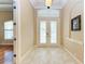Bright and spacious entryway with tile floors and white doors at 4713 Mainsail Dr, Bradenton, FL 34208