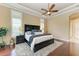 Large main bedroom with hardwood floors and a plush carpet at 4713 Mainsail Dr, Bradenton, FL 34208