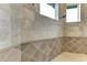 Walk-in shower with tile surround and built-in seating at 4713 Mainsail Dr, Bradenton, FL 34208