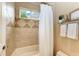 Bathroom with shower/tub combo and updated tile at 4713 Mainsail Dr, Bradenton, FL 34208