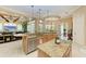 Open kitchen with large island, stainless steel appliances, and breakfast bar at 4713 Mainsail Dr, Bradenton, FL 34208