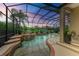 Relaxing screened pool and spa area with waterfall feature at 4713 Mainsail Dr, Bradenton, FL 34208