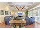 Relaxing living room featuring a large sectional sofa and coffered ceiling at 4713 Mainsail Dr, Bradenton, FL 34208