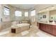 Spa-like bathroom with a large shower and soaking tub at 4713 Mainsail Dr, Bradenton, FL 34208