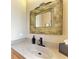Powder room with decorative mirror and sink at 4713 Mainsail Dr, Bradenton, FL 34208