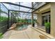 Enclosed pool and spa with a covered patio area at 4713 Mainsail Dr, Bradenton, FL 34208