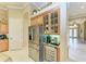 Kitchen boasts stainless steel appliances and wine cooler at 4713 Mainsail Dr, Bradenton, FL 34208
