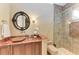 Elegant bathroom with a marble vanity and a walk-in shower at 4713 Mainsail Dr, Bradenton, FL 34208