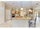 Modern kitchen with granite island and breakfast bar seating at 4713 Mainsail Dr, Bradenton, FL 34208