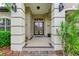 Elegant entryway with double doors and decorative columns at 4713 Mainsail Dr, Bradenton, FL 34208