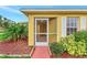 Screened porch entry with a walkway and landscaping at 3530 Adelaide Ave, North Port, FL 34288