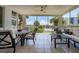 Relaxing screened lanai overlooking the water, featuring comfortable seating and dining at 1260 Dolphin Bay Way # 203, Sarasota, FL 34242