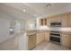 Well-equipped kitchen featuring granite countertops and stainless steel appliances at 1260 Dolphin Bay Way # 203, Sarasota, FL 34242