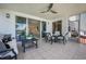 Bright lanai with sliding glass doors, offering both indoor and outdoor living spaces at 1260 Dolphin Bay Way # 203, Sarasota, FL 34242