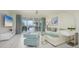 Elegant living room with light, airy feel and access to a spacious lanai at 1260 Dolphin Bay Way # 203, Sarasota, FL 34242