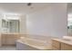 Relaxing bathroom with double sinks, corner soaking tub and updated fixtures at 1260 Dolphin Bay Way # 203, Sarasota, FL 34242