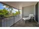Spacious balcony overlooking lush tropical landscape at 1260 Dolphin Bay Way # 203, Sarasota, FL 34242