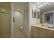 Updated bathroom with shower, toilet, vanity, and linen closet at 1260 Dolphin Bay Way # 203, Sarasota, FL 34242