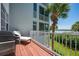 Private balcony with grill and lounge chairs, overlooking the water at 1260 Dolphin Bay Way # 203, Sarasota, FL 34242