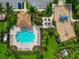 Aerial view of a beautiful pool, clubhouse, playground, and landscaping in a lovely neighborhood at 2352 Marton Oak Blvd, North Port, FL 34289