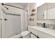 Clean bathroom featuring patterned tiles, a modern vanity, and a shower with a gray curtain at 2352 Marton Oak Blvd, North Port, FL 34289
