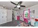 Bedroom with grey walls, pink dresser, princess decor and a view of the closet at 2352 Marton Oak Blvd, North Port, FL 34289