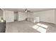 Spacious bonus room with plush carpet, ceiling fan, and ample natural light at 2352 Marton Oak Blvd, North Port, FL 34289