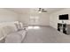 Bright bonus room with plush carpeting, comfortable seating, and neutral decor with ample natural light at 2352 Marton Oak Blvd, North Port, FL 34289
