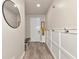 Inviting entryway with a modern mirror, bench seating, and stylish wall paneling at 2352 Marton Oak Blvd, North Port, FL 34289