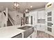Well-appointed kitchen featuring a farmhouse sink, stainless steel appliances, a pantry, and quartz countertops at 2352 Marton Oak Blvd, North Port, FL 34289