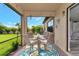Enclosed lanai with seating, a tropical rug, and views of the lush backyard at 2352 Marton Oak Blvd, North Port, FL 34289