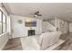 Comfortable living room with a ceiling fan, large window, and a cozy seating arrangement and stairway at 2352 Marton Oak Blvd, North Port, FL 34289