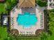 Aerial shot of a pristine pool with lounge chairs and manicured landscaping, perfect for relaxation at 2352 Marton Oak Blvd, North Port, FL 34289