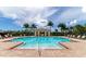 Beautiful pool with a covered pavilion, surrounded by palm trees and comfortable lounge chairs at 2352 Marton Oak Blvd, North Port, FL 34289