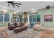 Relaxing game room with leather seating, a fireplace, and pool access at 6935 Cumberland Ter, University Park, FL 34201