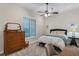 Cozy bedroom featuring a comfortable bed and built-in dresser at 6935 Cumberland Ter, University Park, FL 34201