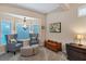 Sitting area with two armchairs and ottomans at 6935 Cumberland Ter, University Park, FL 34201