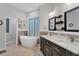 Updated bathroom with double vanity, soaking tub and separate shower at 6935 Cumberland Ter, University Park, FL 34201