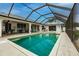 Inviting screened-in pool area, perfect for relaxation at 18154 Brazil Ave, Port Charlotte, FL 33948