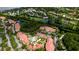 Beautiful aerial view of community with pool, green spaces, and waterway access at 4751 Travini Circle # 4-116, Sarasota, FL 34235