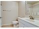 Well-lit bathroom featuring tile flooring, toilet, single sink and shower-tub combo at 4751 Travini Circle # 4-116, Sarasota, FL 34235